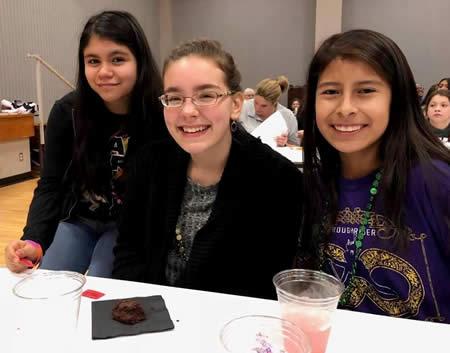 CMS students Stephanie Ruan, Ariel Liker and Cristina Hernandez are shown during a break in the event.