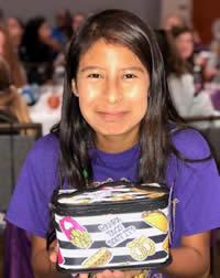 Cristina (pictured) was the recipient of one of several door prizes given to the girls after sessions ended.