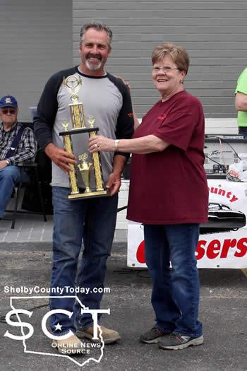 Best of Show winner Mike Burback (left), 1932 Ford Coupe, received his trophy from Shelby County Cruisers club member Cindy Durham (right). 