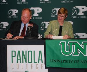 Dr. Greg Powell, Panola College president, signs an articulation agreement with the University of North Texas B.A.A.S. program faculty director, Dr. Peggy Shadduck.