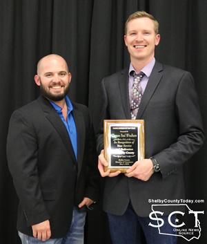 Wil Blackshear (left) presents Clayton Windham with Young Citizen of the Year Award.