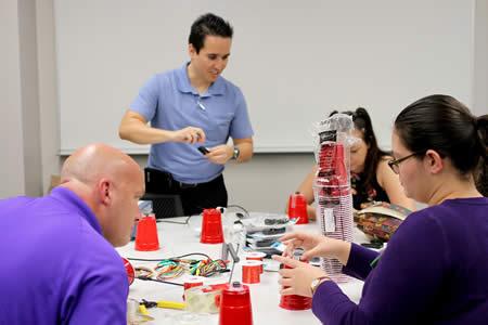 Dr. Hector Ochoa, assistant professor in Stephen F. Austin State University’s Department of Physics, Engineering and Astronomy, explains how to use household items to create a speaker during the School of Honors’ Maker Fair. The fair was designed to introduce students to various disciplines through hands-on activities.