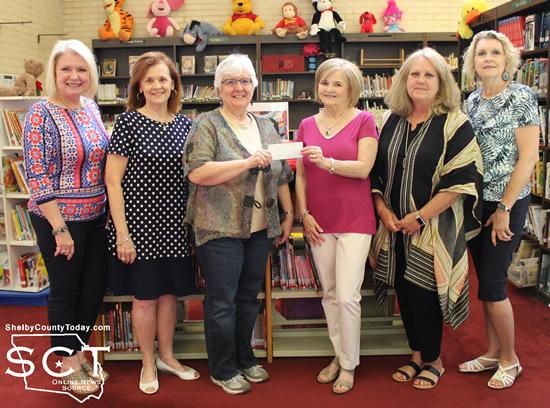 From left: Andi Foster, Montie Jones, Library Director Sandra Davis, Chapter President Sue Russell, Mary Masterson and Laura Rowe
