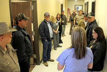 Photo: Tammy Hanson (front right, blue scrubs) leads the Center Firemen, West Shelby Firemen, Center Police Department, and Texas Department of Public Safety on a tour of the new facility