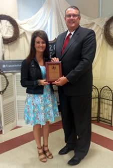 Dr. Doug Steele, Texas A&M AgriLife Agency Director presenting Mrs. McSwain with the New Professional of the Year Award