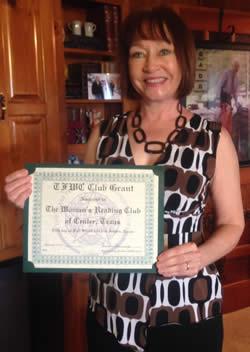 Janene Walker, President, holding the certificate for the Grant received from the Texas Federation of Women in the amount of $200