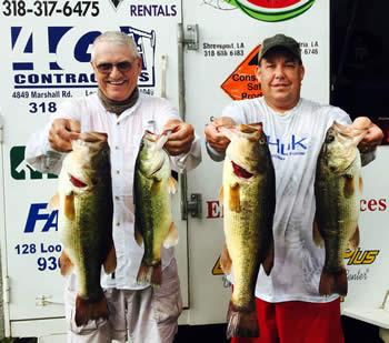 August 24, 2015 - John Olive(left) and Jason Wells(right) show off 4 of their five bass winning stringer.
