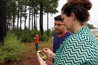 From left, students David Bragg of Shelbyville and Jorge Rodriguez of Carthage, practice their GIS skills with Professor Laura Vance at the Shelby Regional Training Center.