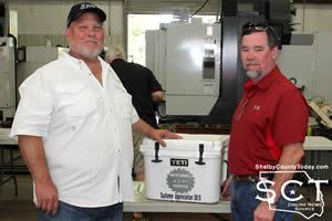 David Wiggs, Southern Band Saw, (right) won a Yeti cooler during the event at Smith Sawmill Service. He's seen with Paul Smith (left).