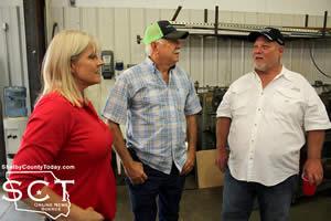 Debbie Daw (left) and Bobby Daw (middle) are seen visiting with Paul Smith (right) during the 25th Anniversary open house held on Friday, August 28, 2015.