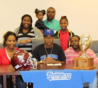 D’Andre Thomas (center) along with his parents Janella Thomas, left front row, and Willie Garner, right front row; sisters Destiny Garner, center row left, D’Chelle Garner, center row right, and sister D’Lashia Garner, back row, along with cousin, Aubrey McClure.