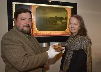 December 15, 2015 - Michael Rugeley Moore, left, recently donated the ambrotype of the stone house to the Stone Fort Museum. Stone Fort Museum Director Carolyn Spears, right, said the image will be on display at the museum as part of the tricentennial celebration in 2016.
