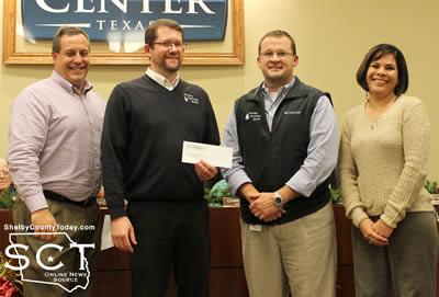 Nehring presents check to Keith Davis, Will Lucas, and Porti Williford, Shelby Savings Bank (Davis & Williford, float artist) - Business Category, 1st Place