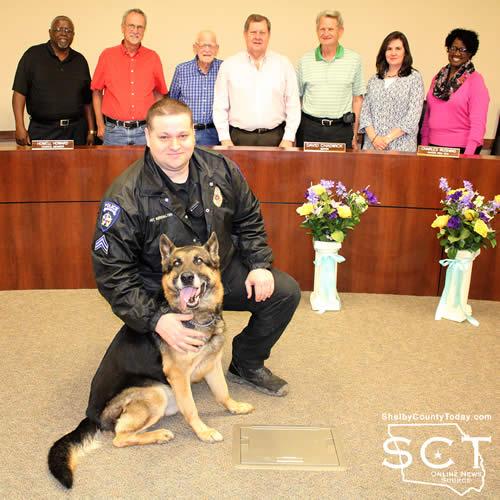 Center Police Sgt. Scott Burkhalter and K9 Zitan are seen with Center City Council members behind them including (from left) Jerry Lathan, Howell Howard, Jim Forbes, Mayor David Chadwick, Charles Rushing, Leigh Porterfield and Joyce Johnson