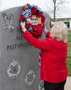 VFW Auxiliary Sr. Vice Sandy Risinger places the memorial wreath.