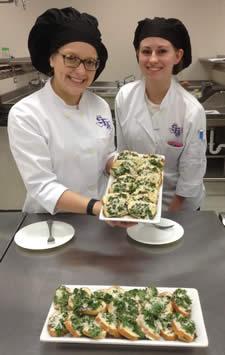 From left, are Stephen F. Austin State University freshman Mallory Jurena, who is majoring in hospitality administration with a focus in restaurant management, and freshman food, nutrition and dietetics major Hollin Jordan prepared a mozzarella pesto bruschetta with ingredients from Appleby Community Farm in Nacogdoches. This meal was part of a new farm-to-table lab created by Dr. Mary Olle, human sciences professor at SFA.