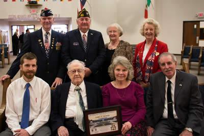 Photo front row (from left), Mr. Woods’s grandson Clifford Grimes, Mr. Wood, his daughter Debbie Grimes and son-in-law Eddie Grimes. Back row l-r, Post Quartermaster Larry Hume, Post Chaplain Gene Hutto, Auxiliary Chaplain Mary Fausett and Auxiliary Sr. Vice Sandy Risinger.