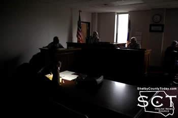 Shelby County Judge Allison Harbison (pictured middle) presided over a darkened courtroom on Monday, May 11, 2015. Jennifer Fountain (foreground left), Shelby County Clerk, is seen taking notes by cell phone light.