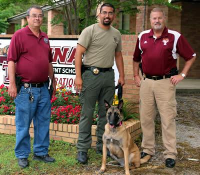 Pictured is Shelby County Constable, Bryan Gray, Panola County K9 deputy Richard Mojica and his K9 Roxie, and Tenaha ISD Police Chief David Jeter.