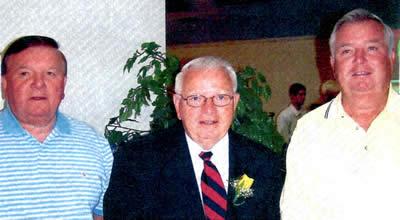 Elmer Mathews stands between his two brothers, Johnny and Don.