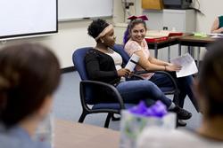 Alexis Willis, left, and Victoria Pentecost speak to their PSY153: Human Sexuality class after completing their service learning projects in December. The course will continue the partnership with the Janelle Grum Family Crisis Center of East Texas in the fall semester.