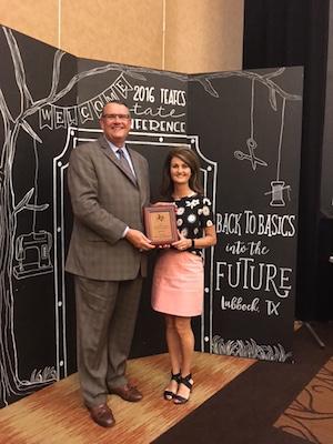 Dr. Doug Steele, Texas A&M AgriLife Agency Director presenting Mrs. McSwain with the New Professional of the Year Award