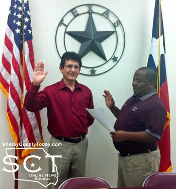 Jose Leos (left) is seen taking his oath of office as a new council member as Mayor Orinthia Johnson (right) recited the oath.