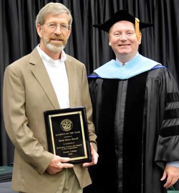 Dr. Greg Powell poses with the 2019 award for Panola College Alumnus of the Year, Mr. David Glynn Russell.