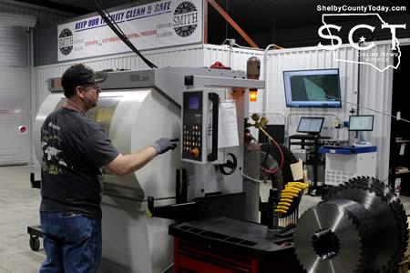 Matt Barton is seen programming the Vollmer GPA 200 which is used to tip saw blades.