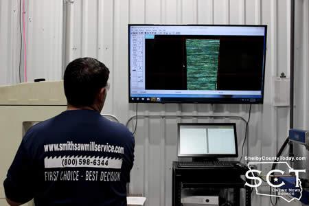 Michael Smith is seen using a video microscope to perform quality control by examining blade tips.
