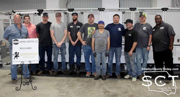 Paul Smith and Michael Smith are seen pictured with their team of dedicated and skilled staff.