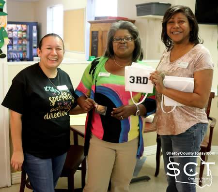 Pictured are (from left): Tina Hutto, Activities Director; Cassandra McDaniel; and Jessica Davis, Executive Director of Operations.